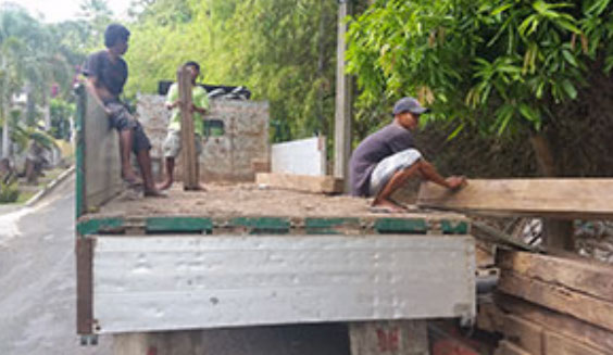 Picture of recycled timber being unload at Jarrah Works Fine Furniture