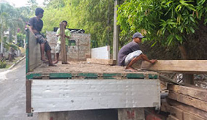 Picture of recycled timber being unload at Jarrah Works Fine Furniture